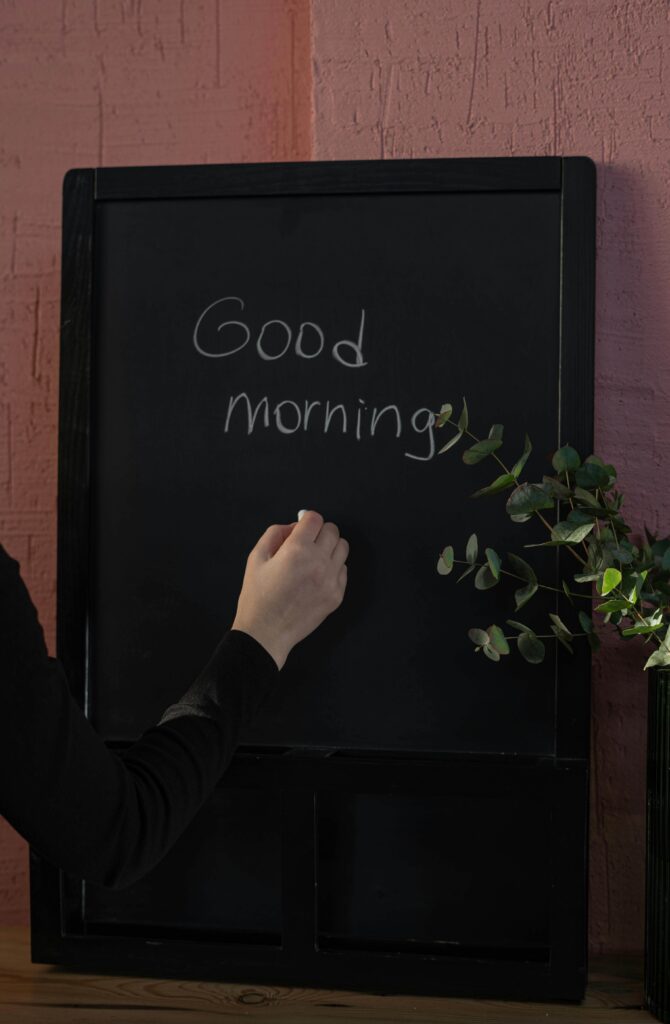 Person enjoying a brain-boosting morning routine with a nutritious breakfast and journaling.