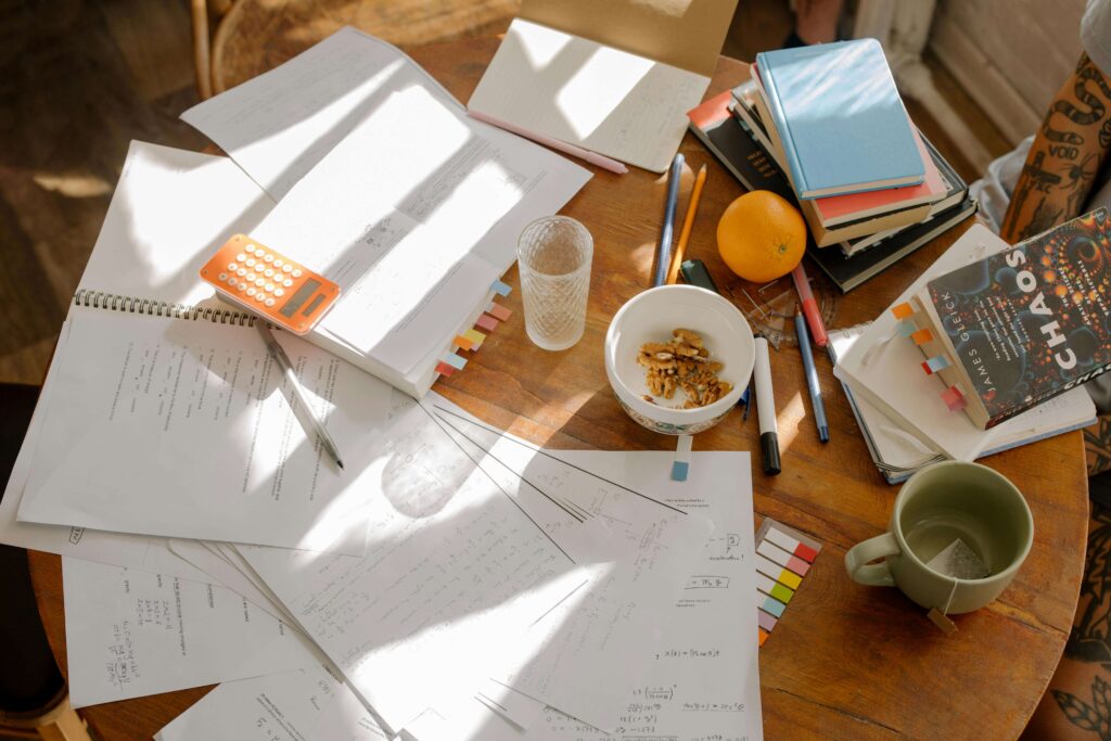 Person studying with books, illustrating the concept of improving learning and retention.