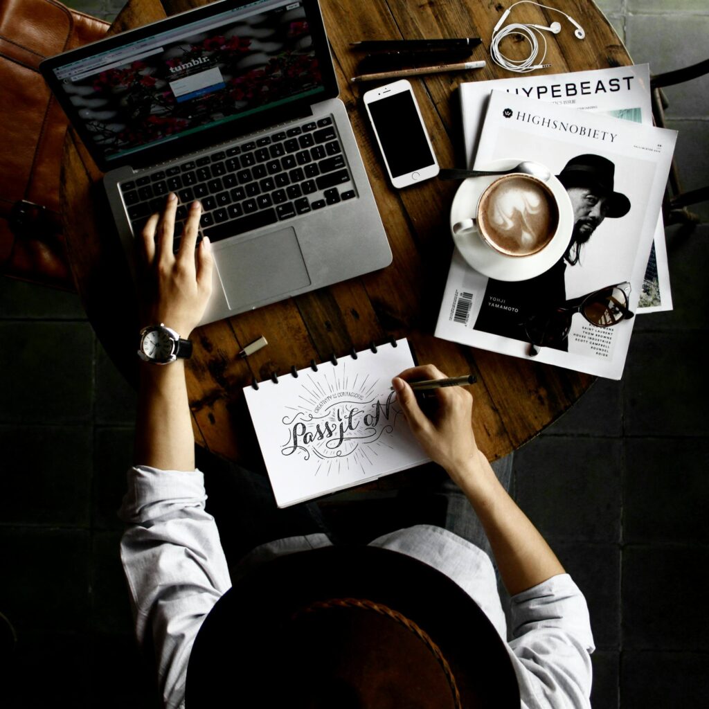 Image of a professional focused on work, using a computer in an organized workspace.